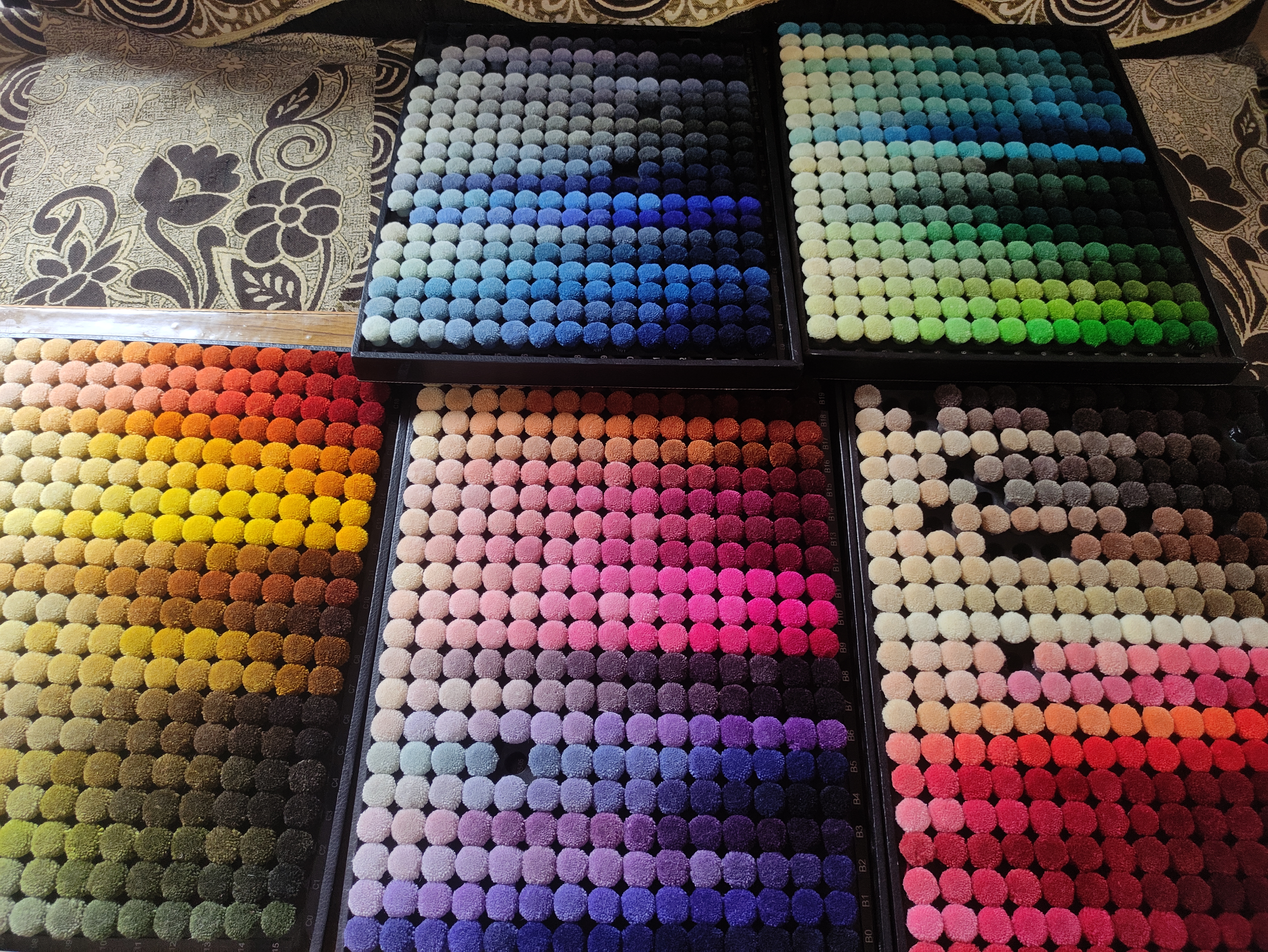 Bhadohi artisan weaving a luxury wool rug by hand